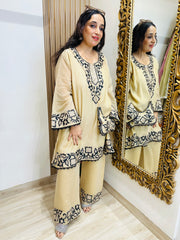 STITCHED PURE MULMUL CHANDERI KASHMIRI WORK INSPIRED CHOGA SETS WITH FARSHI SALWAR AND EMBROIDERED BAGS.