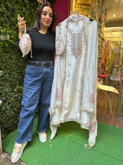 Unstitched PURE SHIMMER SILK SUITS WITH NALKI WORK AND POTLI.