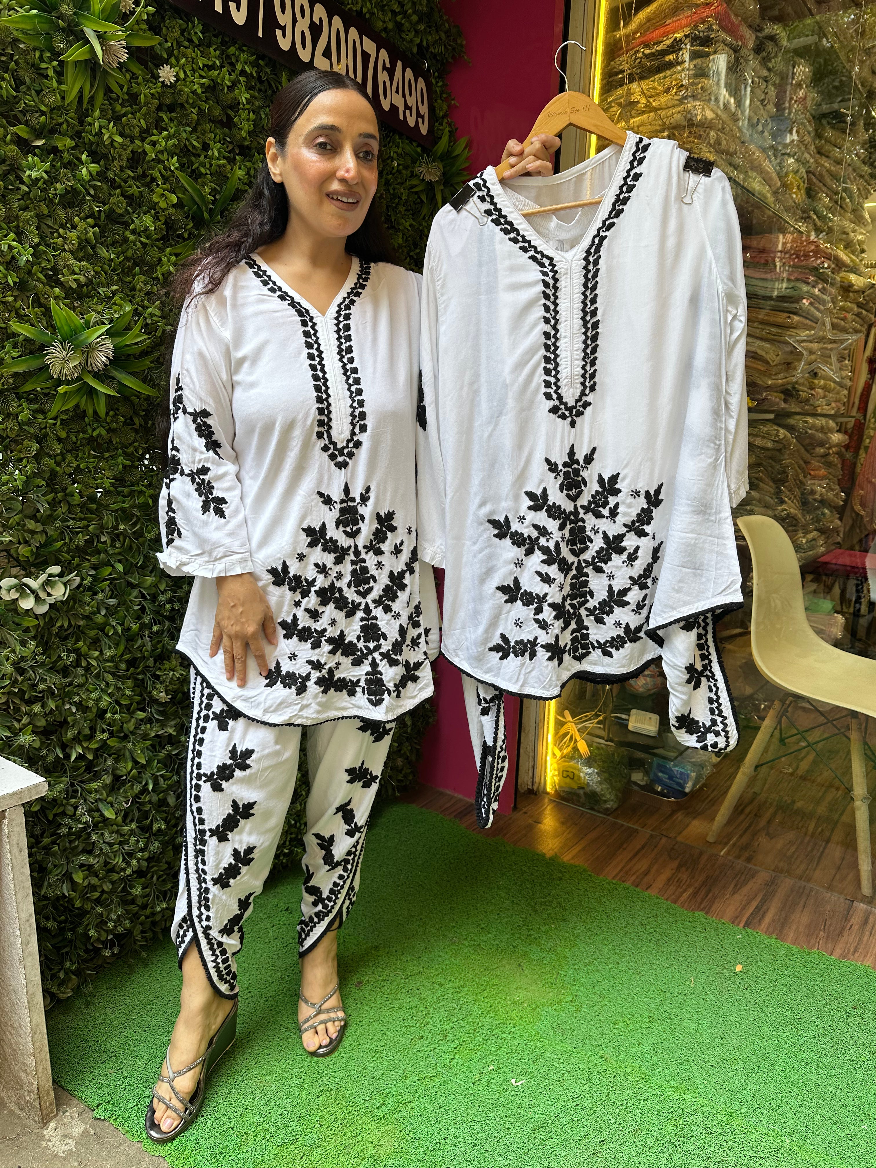 S..TITCHED PURE MULMUL HANDWORK DHOTI SETS.